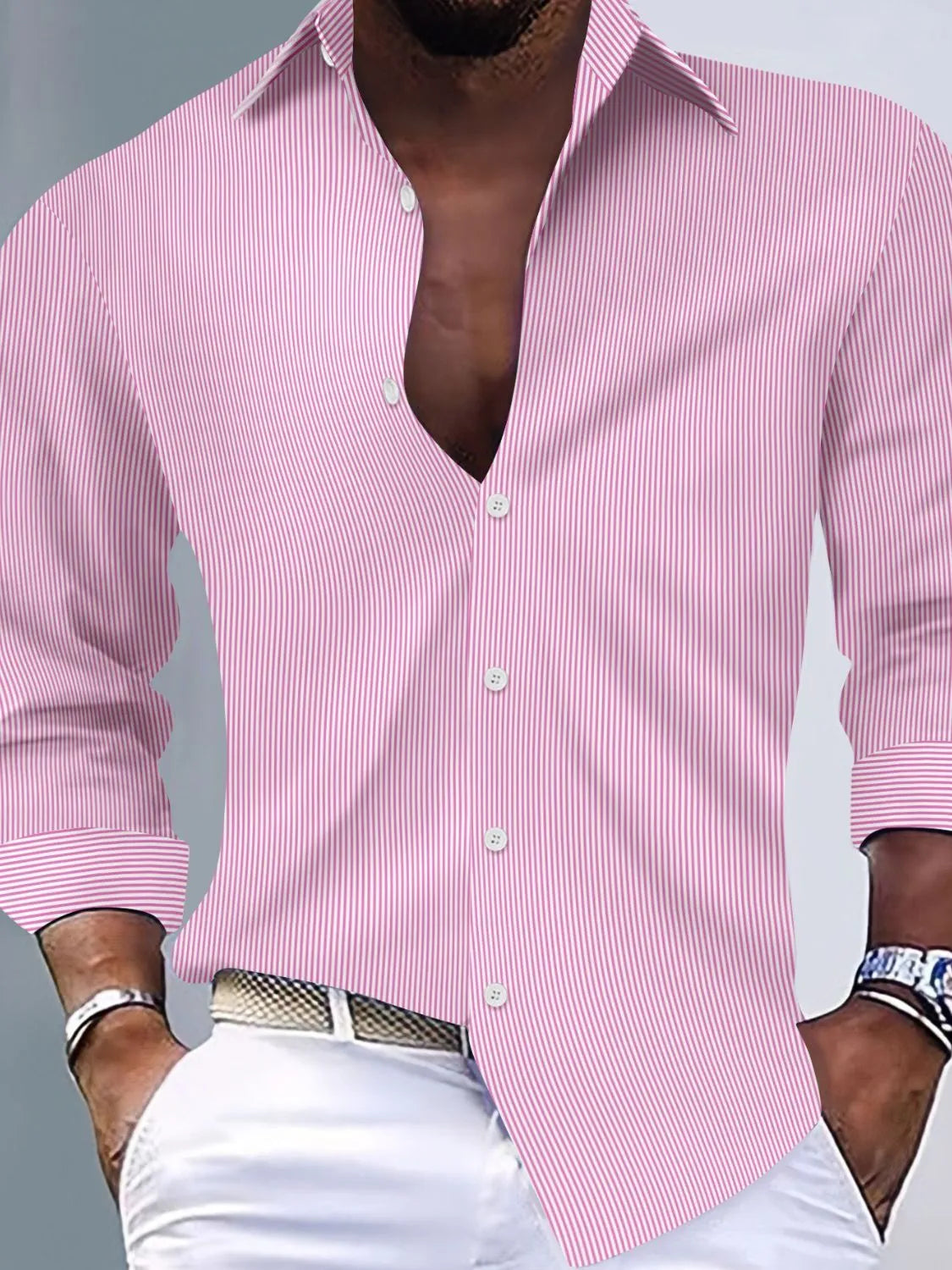 Pink men's striped button-up long-sleeve shirt shown on a model. Shirt only; trousers, belt, watch and jewelry are not included.
