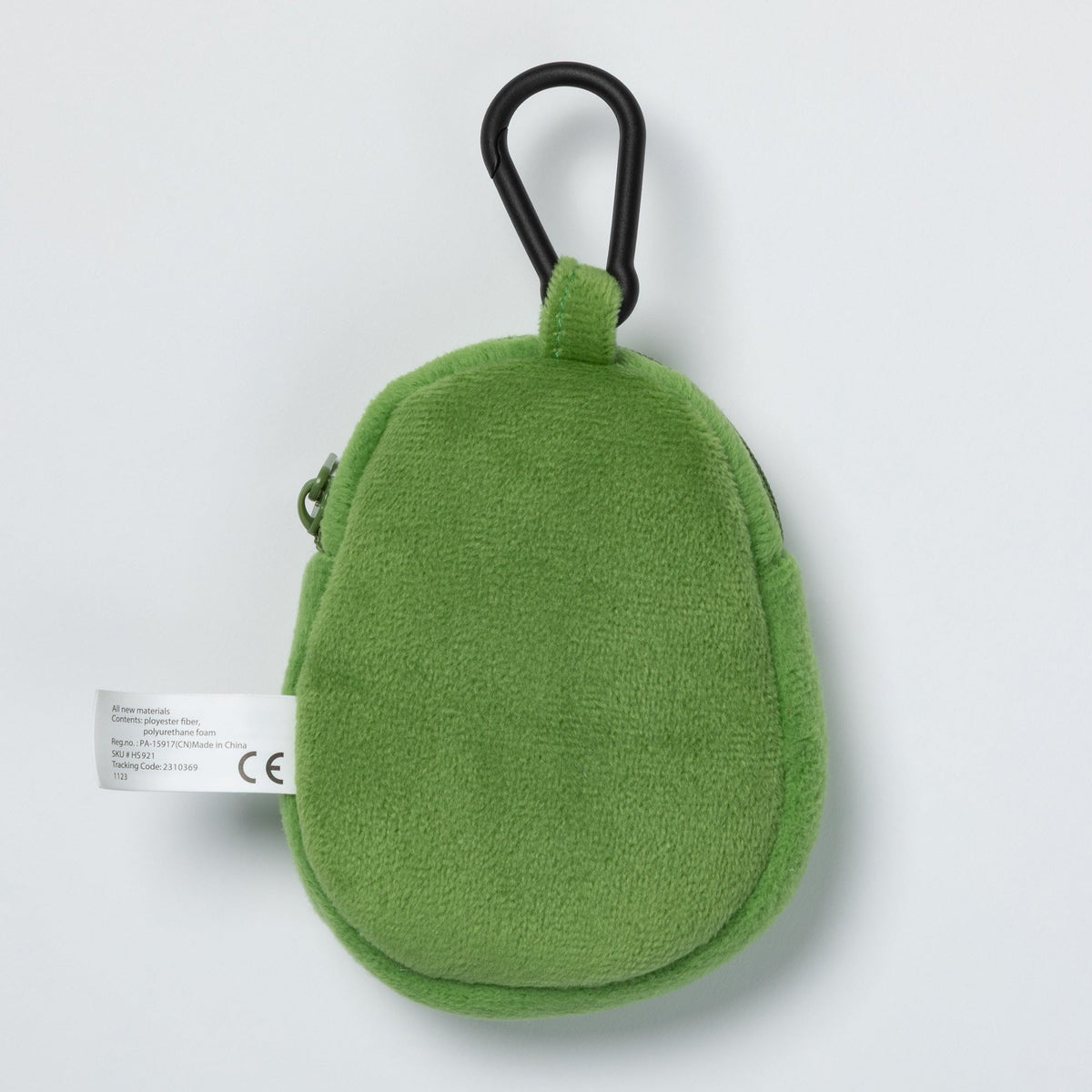 Back of the green avocado waste bag dispenser with attached black clip.