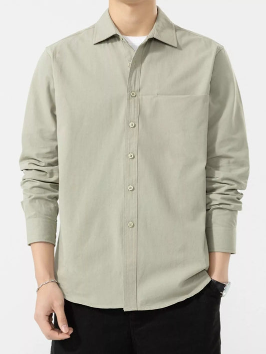 Pale sage long-sleeve shirt shown buttoned from the front, with a collar and chest pocket.
