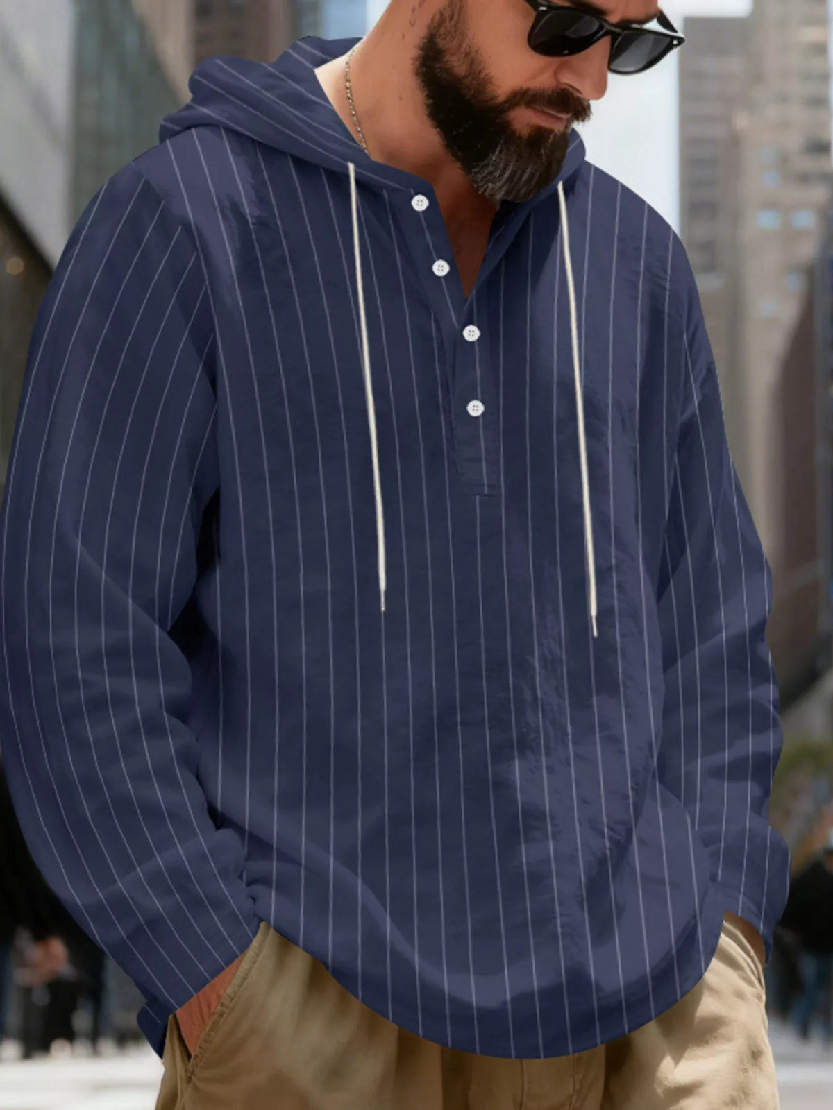 Men's striped Henley hoodie in Navy Blue — neckline and upper front view showing the hood and buttoned neckline; trousers and accessories are styling only.