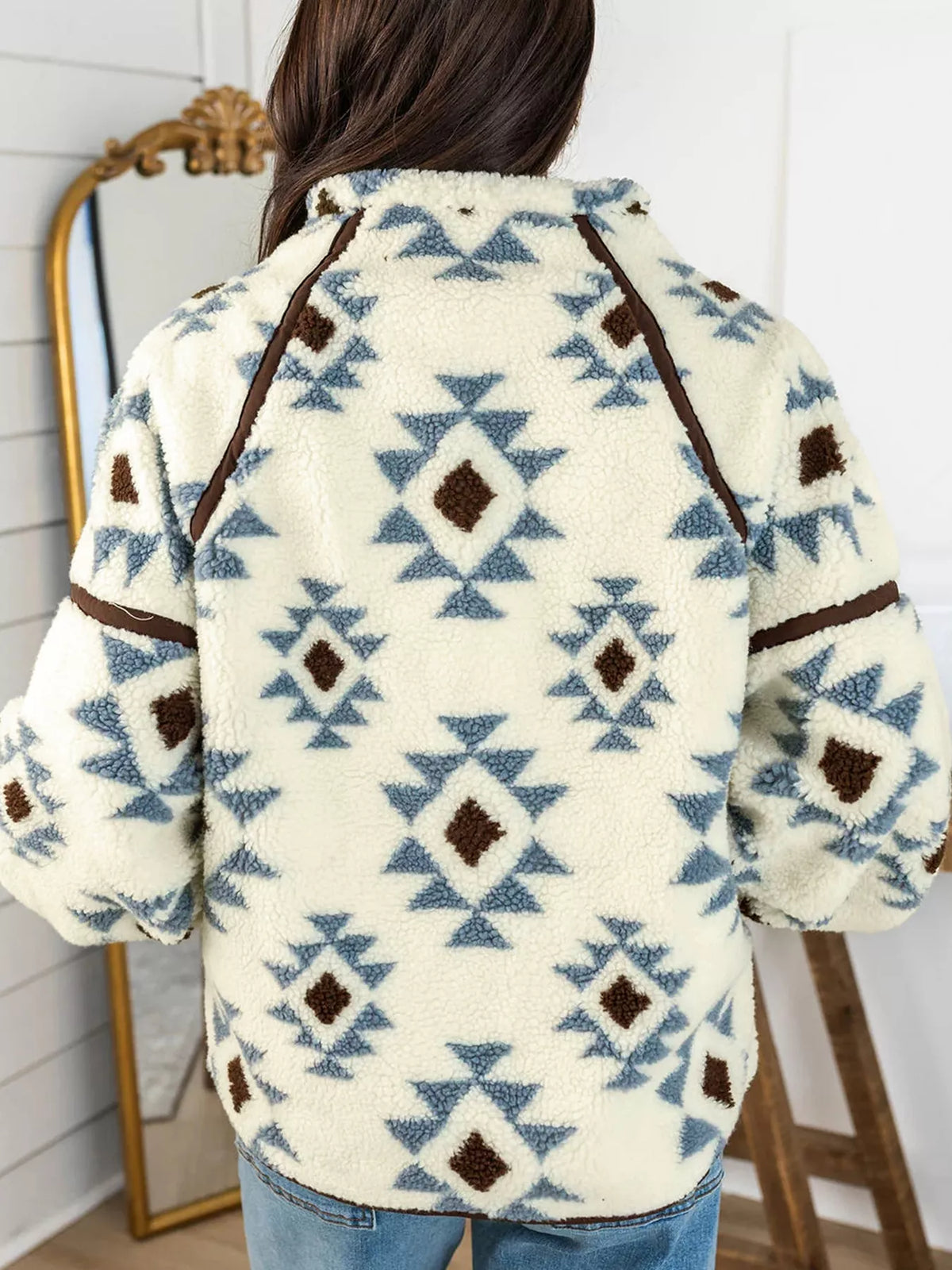 Back view of the beige geometric sherpa sweatshirt with brown seam trim.