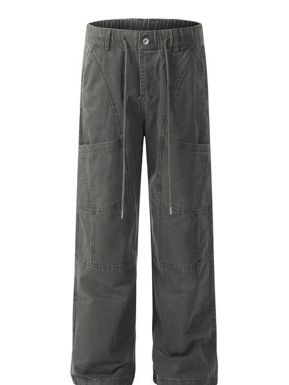 Garment-only front view of grey cotton cargo trousers with drawstrings, front pockets and knee seams.