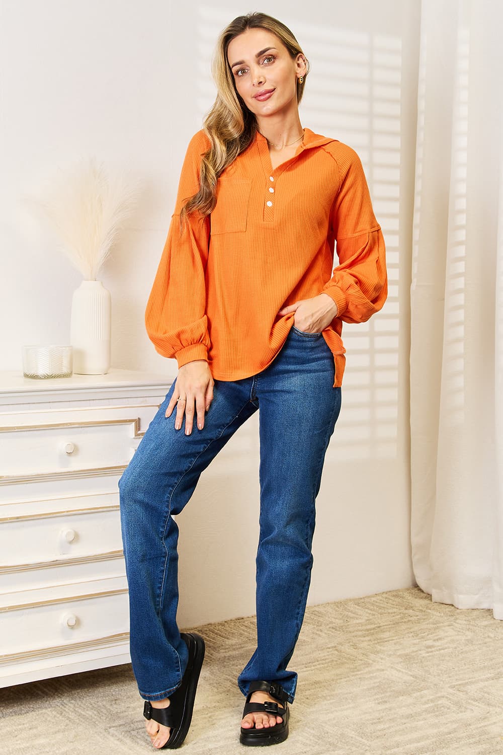 Orange side-slit hoodie, full styling view; jeans and shoes not included