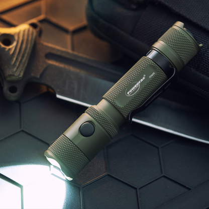 OD Green Powertac M5 Gen3 flashlight illuminated in a dark setting