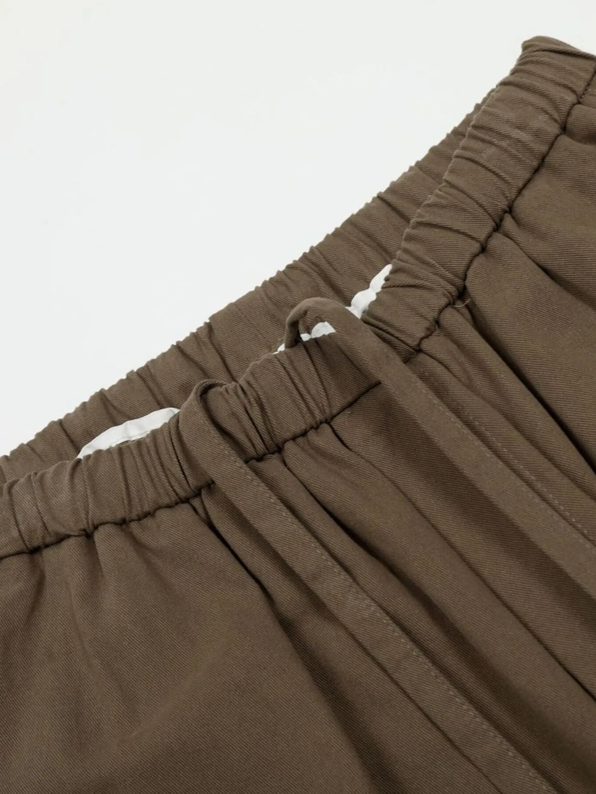 Olive brown men's wide-leg drawstring trousers — elastic waist and drawstring detail
