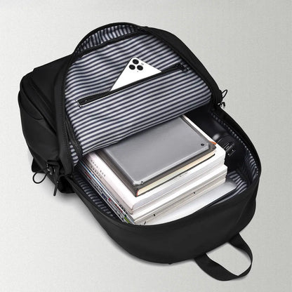 Open black backpack with striped lining; books and electronic devices shown inside are not included