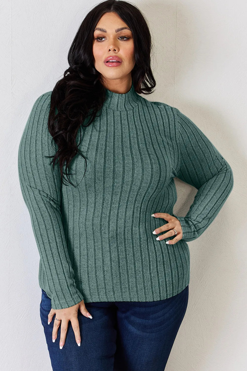 Turquoise ribbed mock-neck long-sleeve top, product view; one top included, jeans and accessories excluded