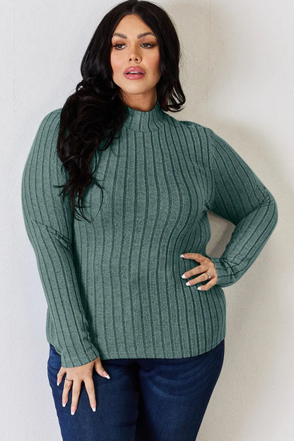 Turquoise ribbed mock-neck long-sleeve top, product view; one top included, jeans and accessories excluded