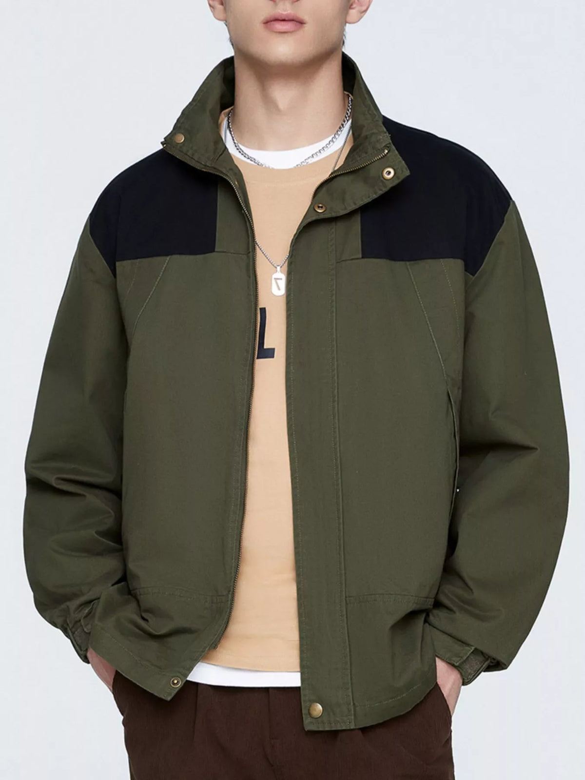 Army Green two-tone men's jacket shown from the front with hands in the side pockets; styling items are not included.