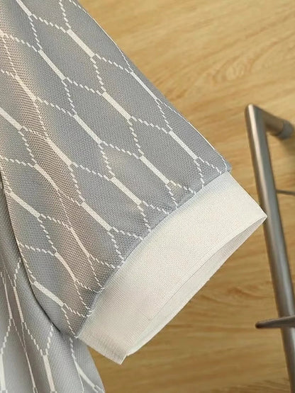 Close view of the Grey polo's diamond-pattern fabric and light ribbed sleeve edge.
