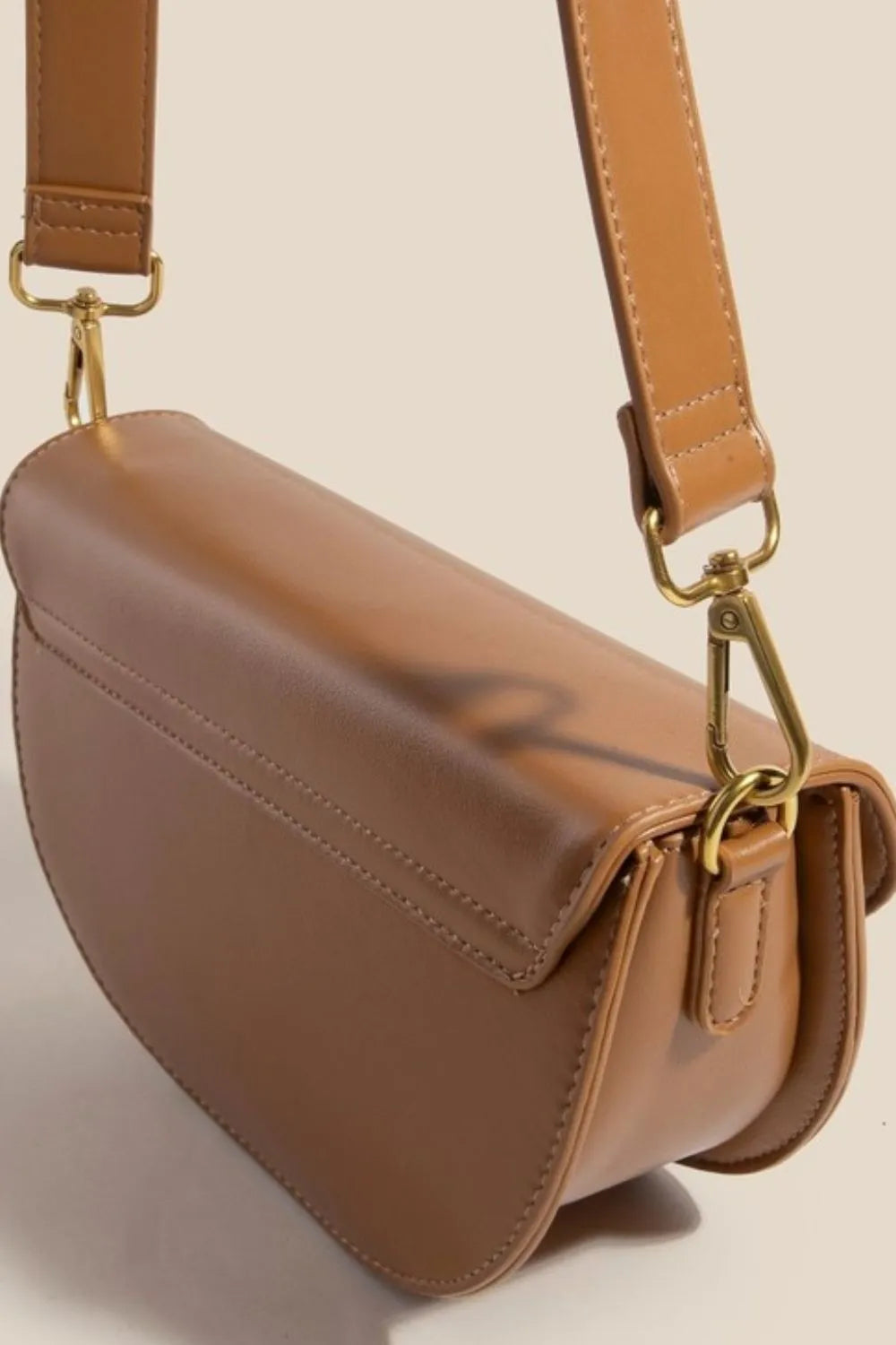 Camel crescent crossbody bag, back and side view