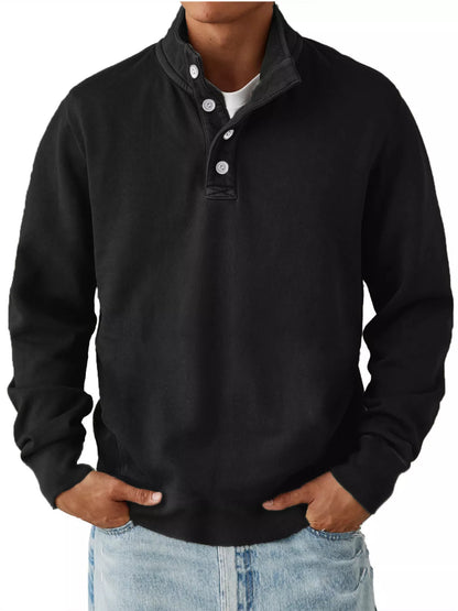 Black men’s long-sleeve sweatshirt with stand collar and button placket, worn over a separate light T-shirt and jeans. One sweatshirt only.