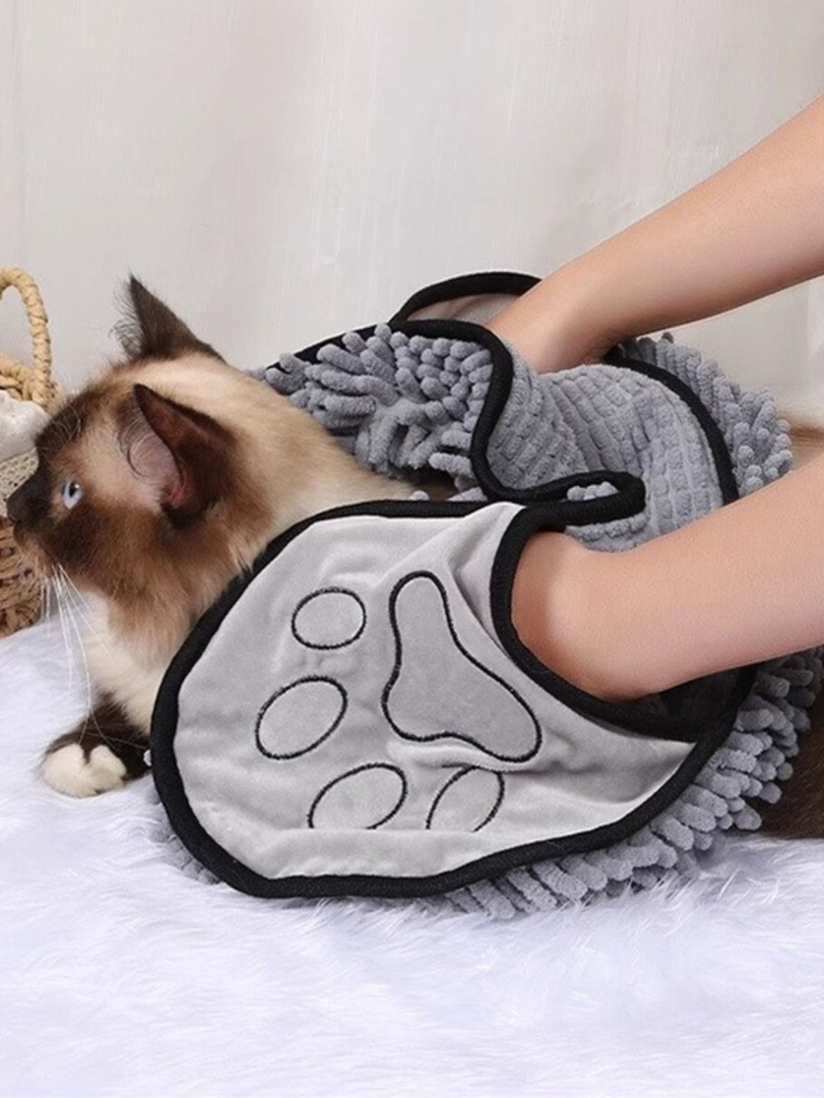 Gray paw-print pet towel demonstrated drying a cat; one towel