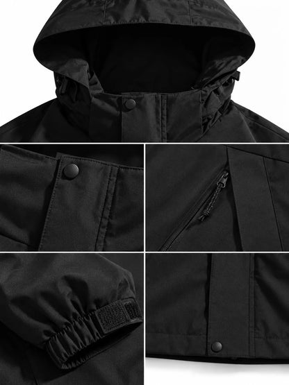 Black windbreaker hood, snap front, zipped pocket and cuff details.