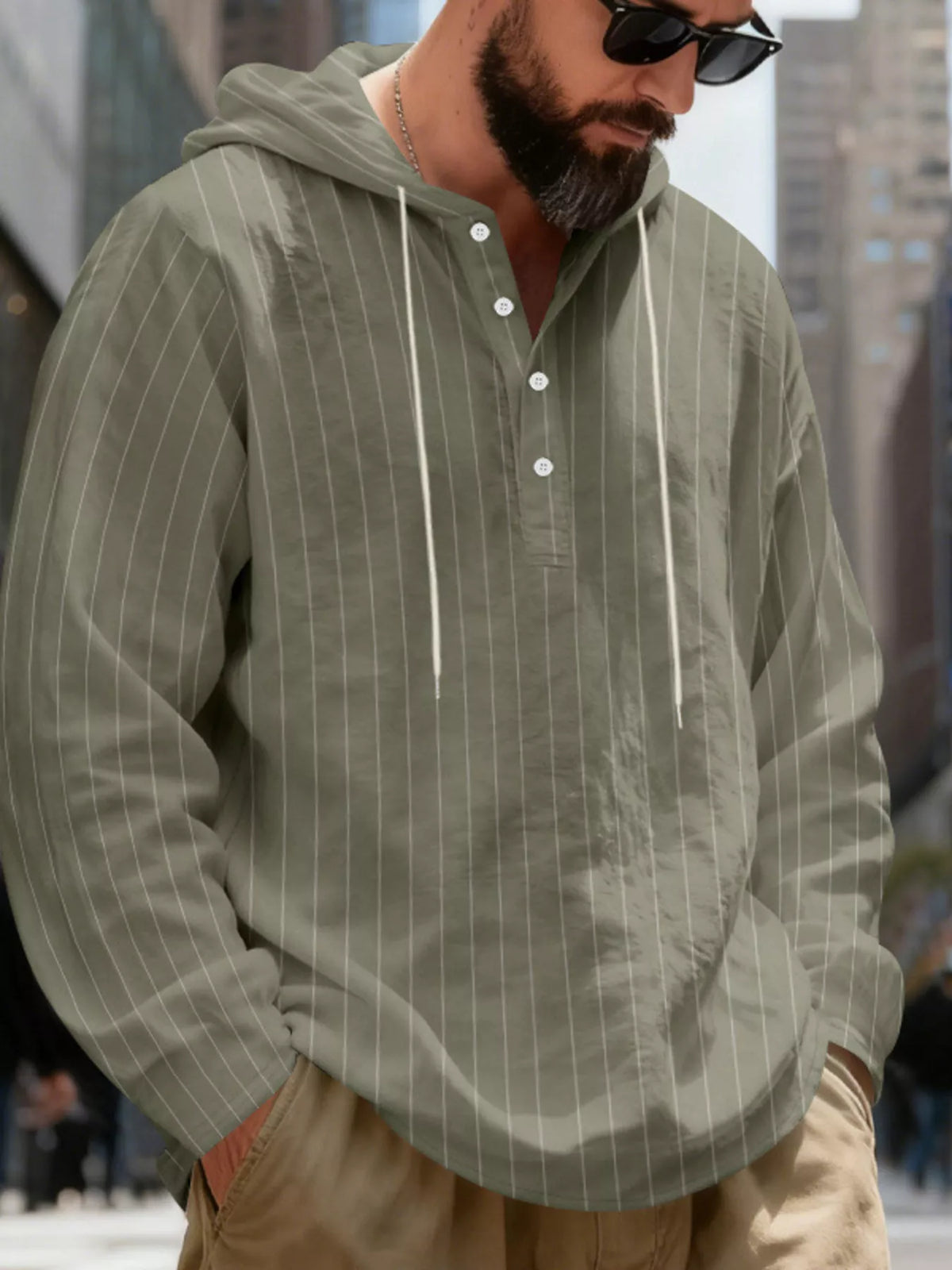 Men's striped Henley hoodie in Army Green — neckline and upper front view showing the hood and buttoned neckline; trousers and accessories are styling only.