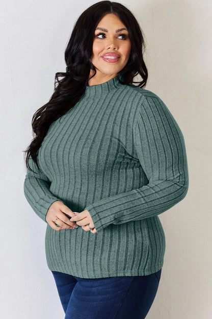 Turquoise ribbed mock-neck long-sleeve top, product view; one top included, jeans and accessories excluded
