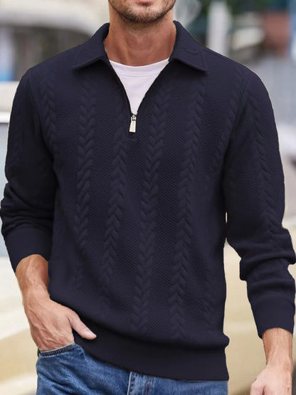 Men's navy cable-textured quarter-zip pullover with pointed collar and ribbed cuffs and hem, shown on a model.