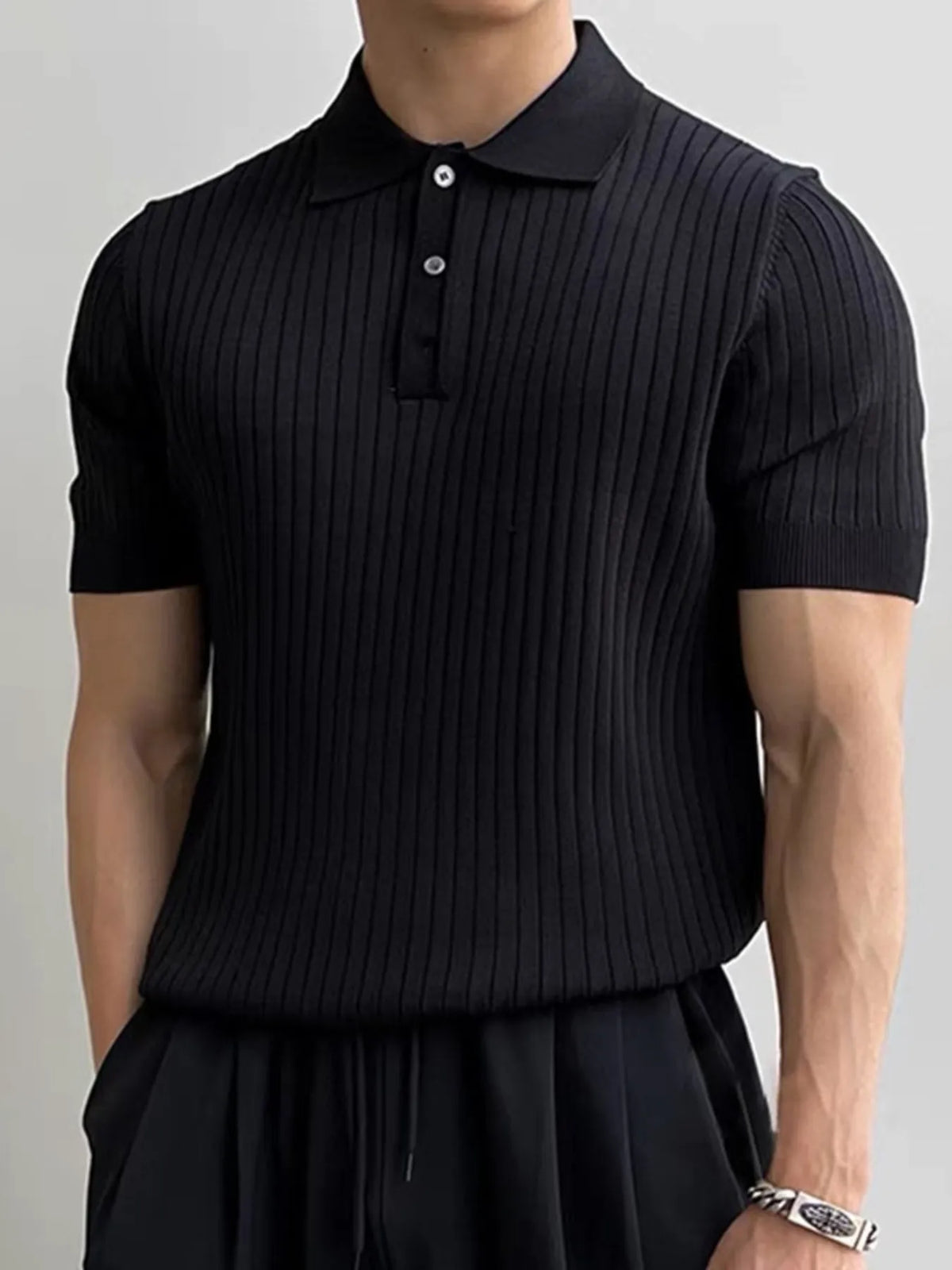 Men's Black ribbed knit polo, front view; polo only