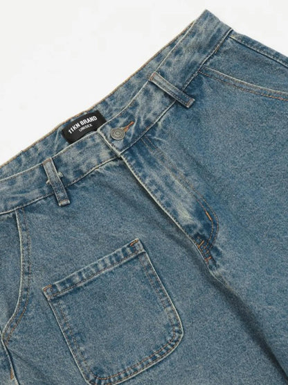 Close-up of the blue cargo jeans front waistband, belt loops and patch pocket.