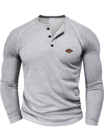 Light gray men’s waffle-knit Henley, front view.
