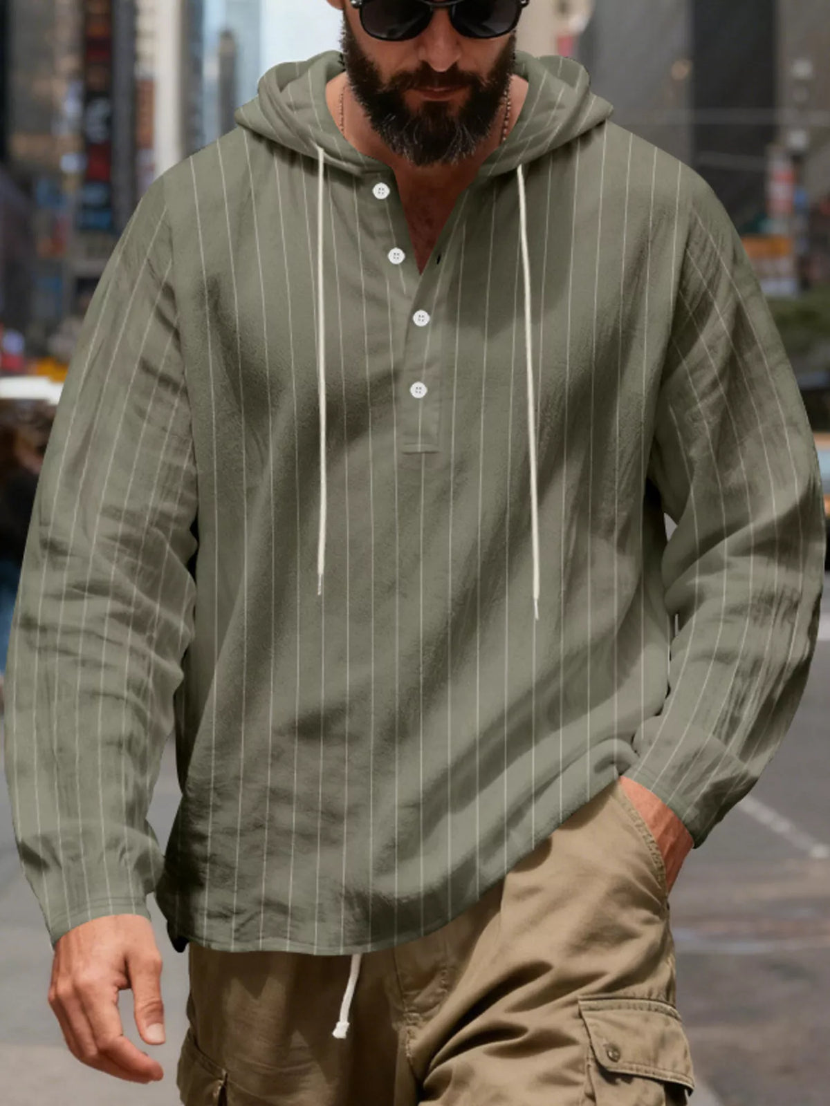Men's striped Henley hoodie in Army Green — front view showing the hood and buttoned neckline; trousers and accessories are styling only.