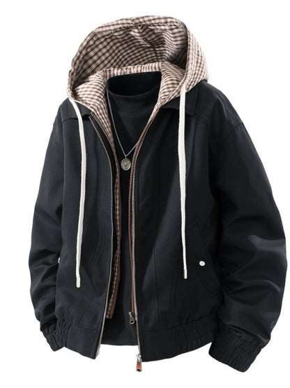 Black hooded zip-up jacket with checked hood lining and pockets; styled underlayer and necklace are not included.