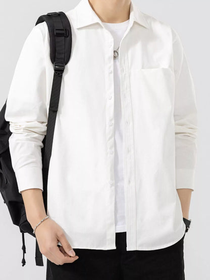 White button-front shirt shown open with a black bag; underlayer and bag are not included.