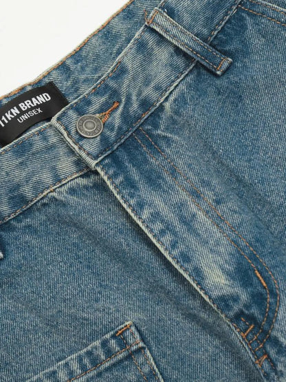 Detailed view of the jeans waistband button, belt loop and fly stitching.