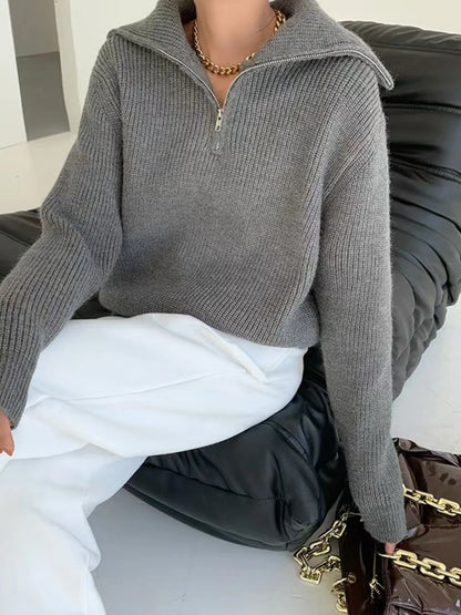 Half-zip long-sleeve ribbed sweater with a high collar.
