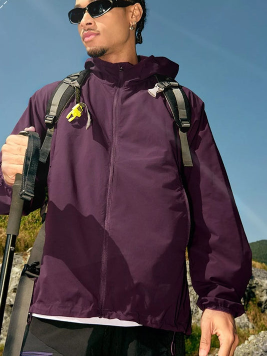 Fig-purple hooded zip-front jacket, front view worn outdoors