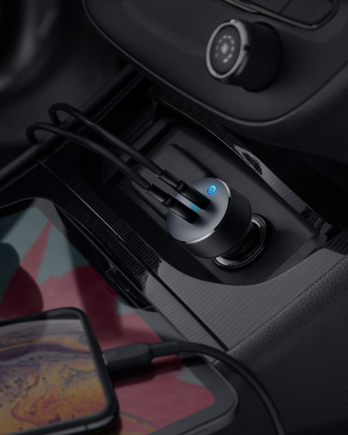 Anker PowerDrive III Duo installed in a car socket; phones and cables not included