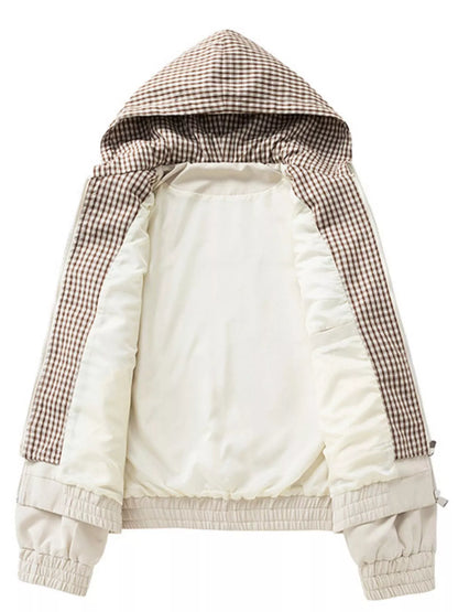 Apricot jacket held open to show its plain body lining and checked hood lining.