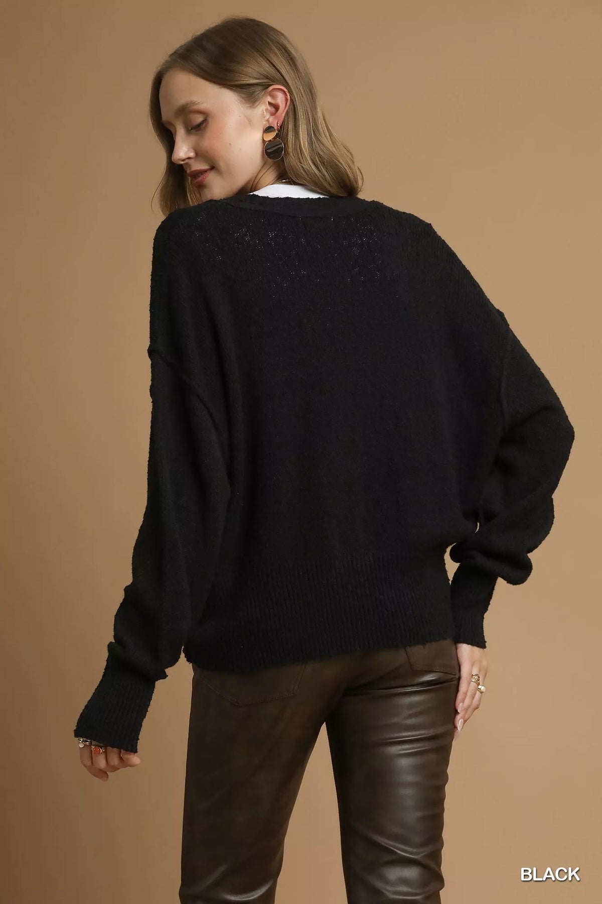 Back view of the Umgee black long-sleeve knit cardigan