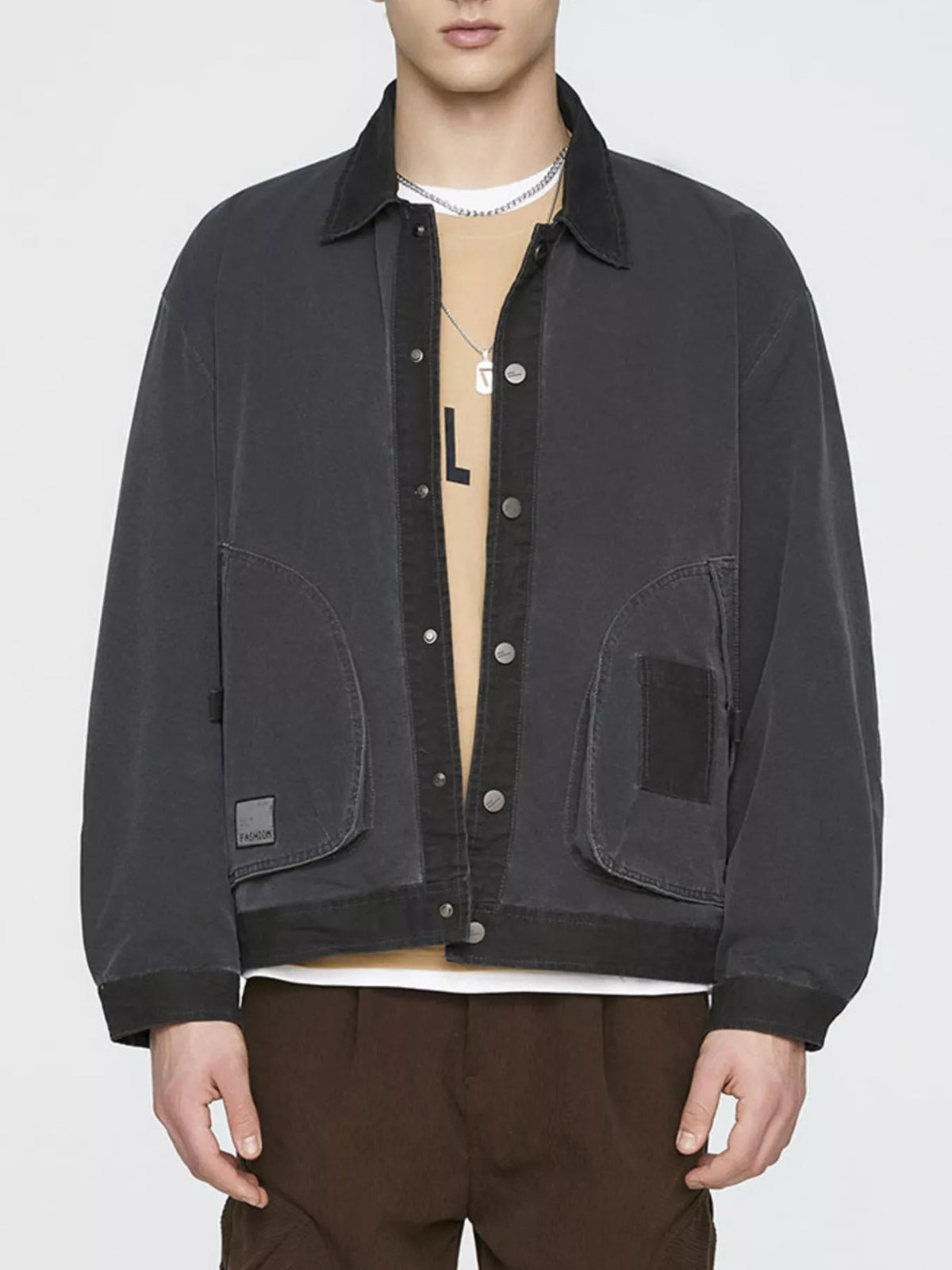 Men's black jacket, straight front view showing contrast trim and patch pockets