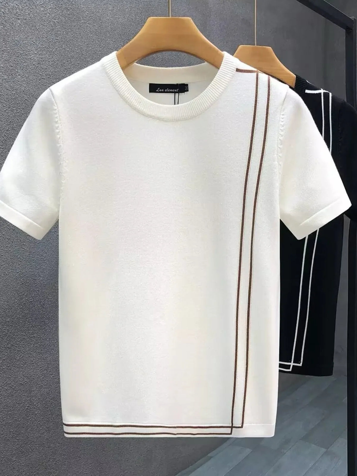 White contrast-trim T-shirt in front, with Black color option behind. One T-shirt per order.