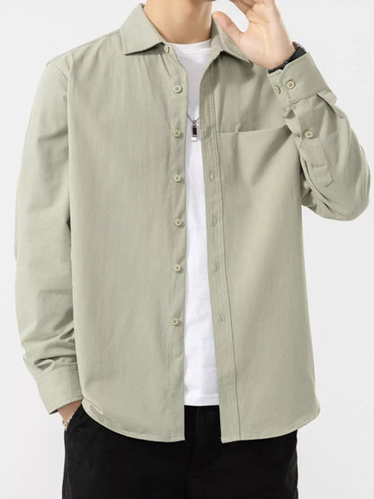 Pale sage shirt shown open over a white underlayer, with button cuffs; underlayer is not included.