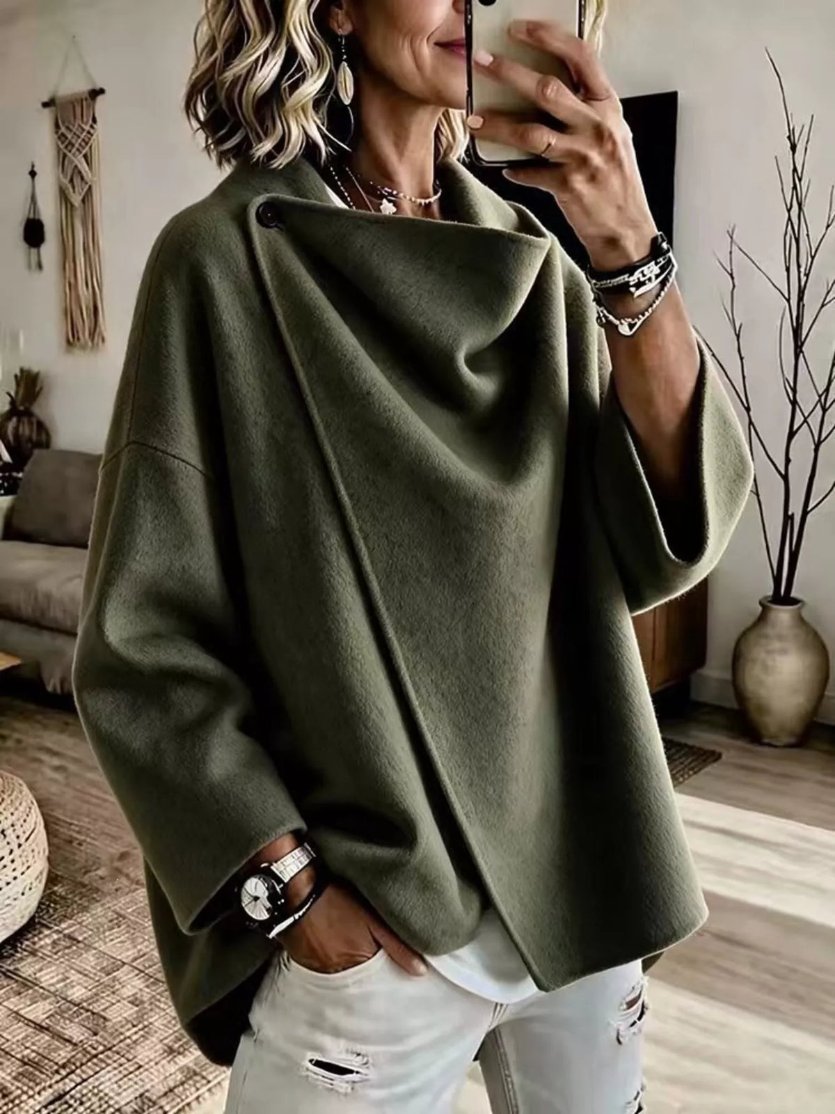 Green asymmetric cowl-neck cape, modeled front view; one cape included