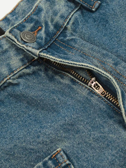 Close-up of the cargo jeans button waistband and open zip fly.