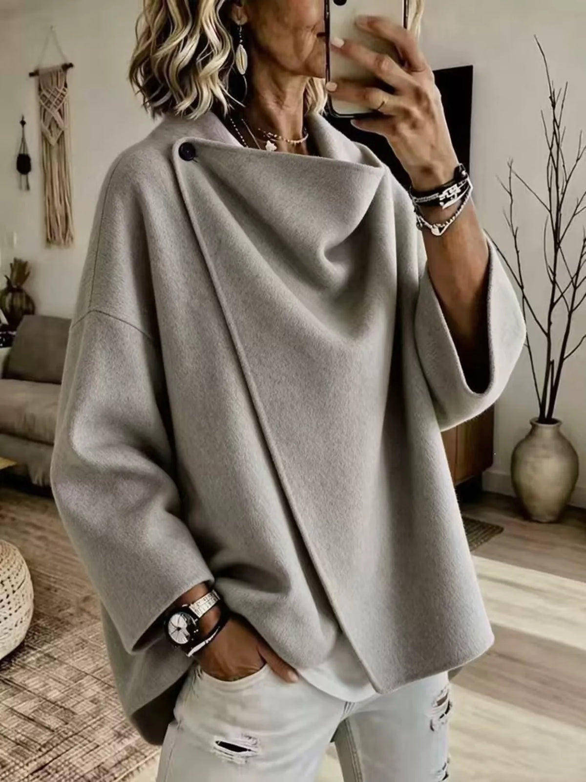Gray asymmetric cowl-neck cape, modeled front view; one cape included