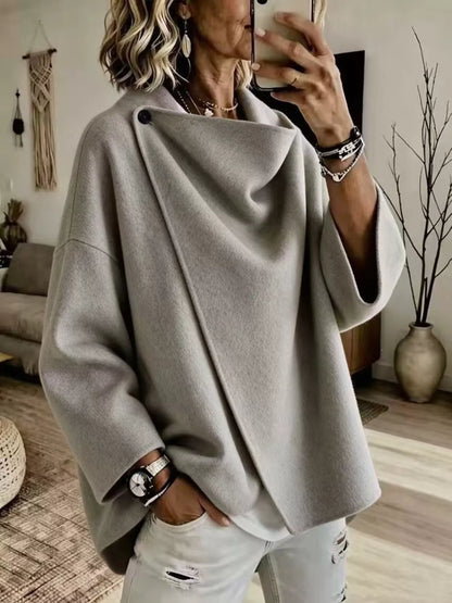 Gray asymmetric cowl-neck cape, modeled front view; one cape included