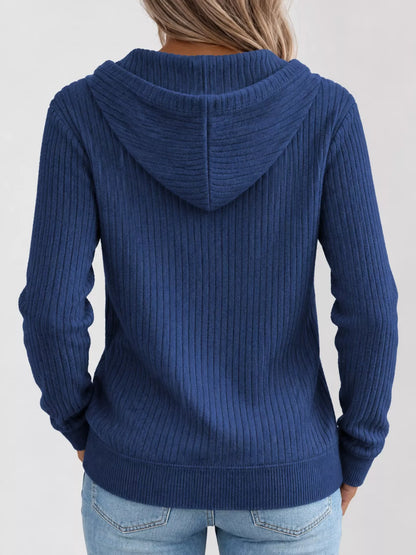 Back view of the blue ribbed zip-front hooded cardigan with long sleeves.