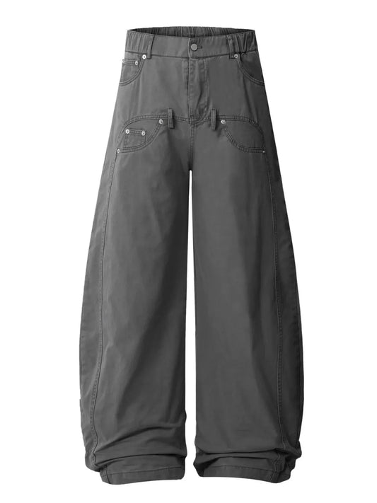 Grey wide-leg trousers with layered front pocket and belt-loop details, front view