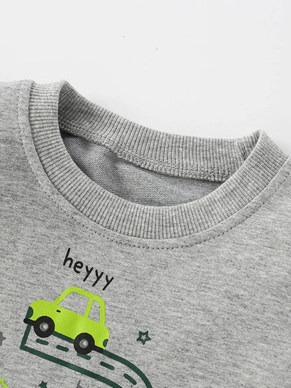 Close view of the sweatshirt's ribbed crew neckline and gray fabric.