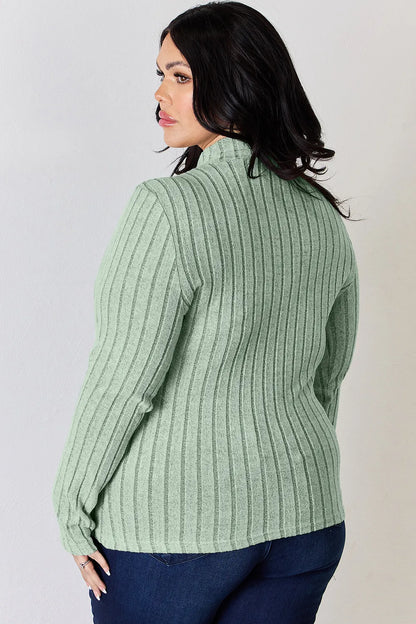 Light Green ribbed mock-neck long-sleeve top, product view; one top included, jeans and accessories excluded