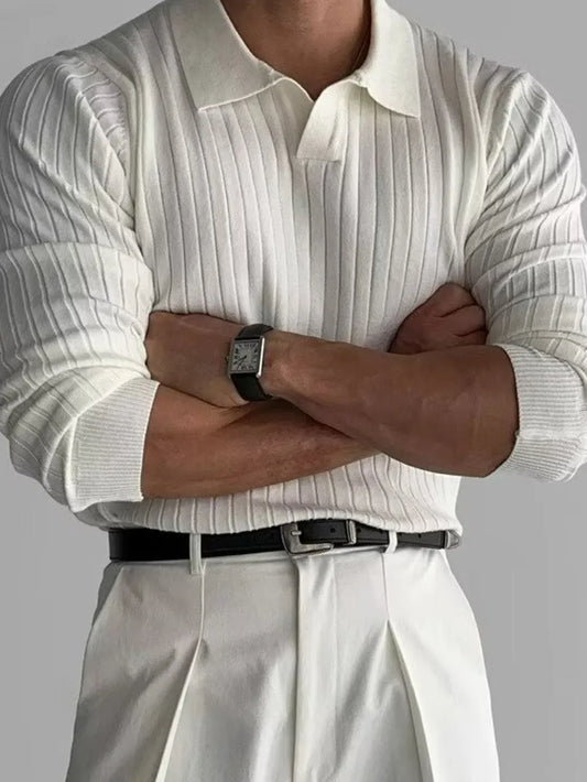 Ivory polo worn with sleeves rolled, front view; polo shirt only.