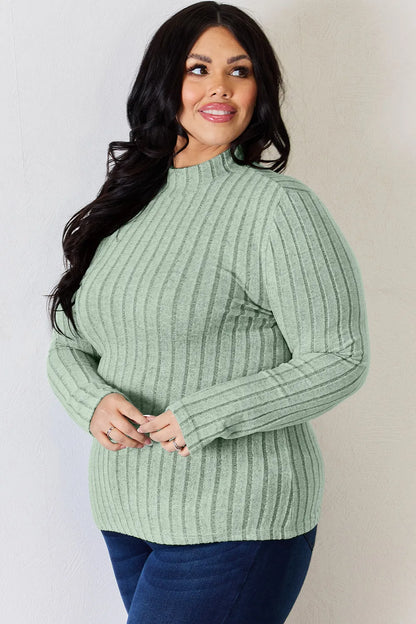 Light Green ribbed mock-neck long-sleeve top, product view; one top included, jeans and accessories excluded