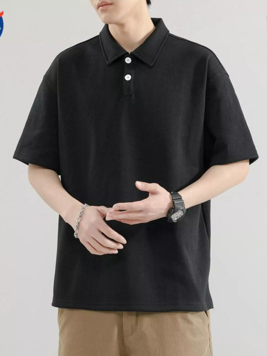 Men's black short-sleeve polo, modelled front view with two-button placket