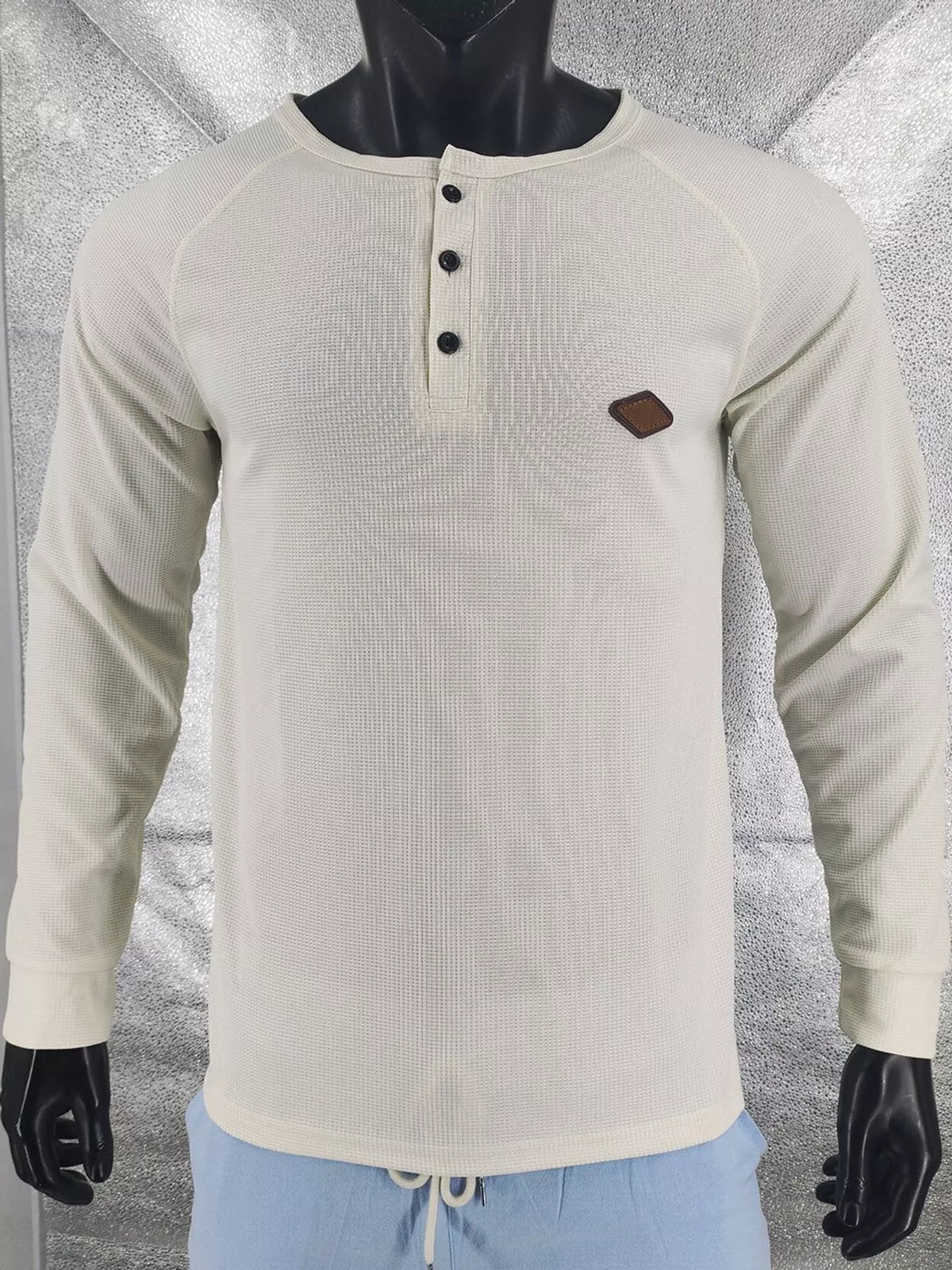 Apricot men’s waffle-knit Henley on a mannequin, front view.