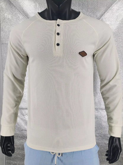 Apricot men’s waffle-knit Henley on a mannequin, front view.