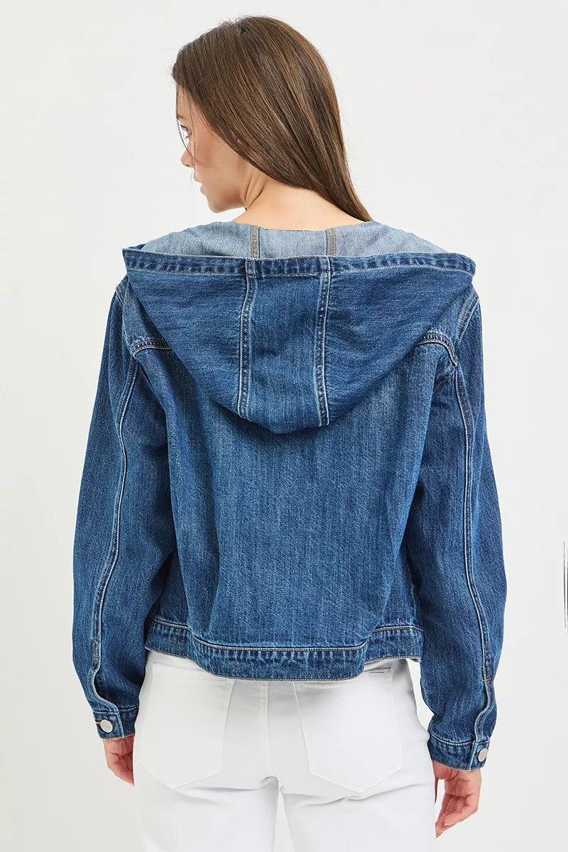 Back view of the RISEN medium-wash denim jacket with the hood lowered